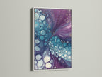 Experience the beauty of abstract fluid art with a white frame. This modern canvas print features purple and teal hues. The bubble artwork creates a serene atmosphere. It's perfect for bedroom wall decor. The white frame offers a clean contemporary look.