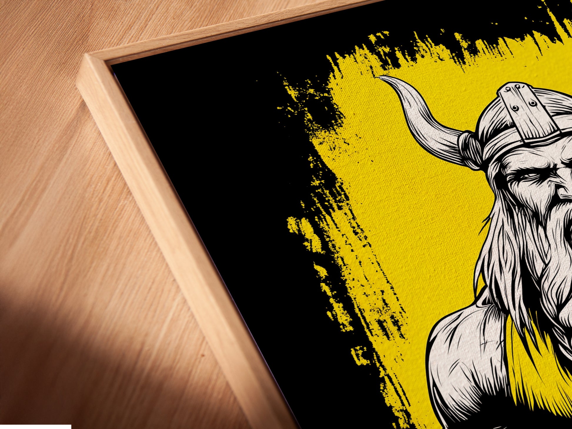 An angled close-up reveals a canvas print in a floating frame. The Viking Warrior artwork is a Nordic mythology piece. The floating frame gives a modern aesthetic. It makes the art appear to hover. This unique framing enhances the man cave decor.