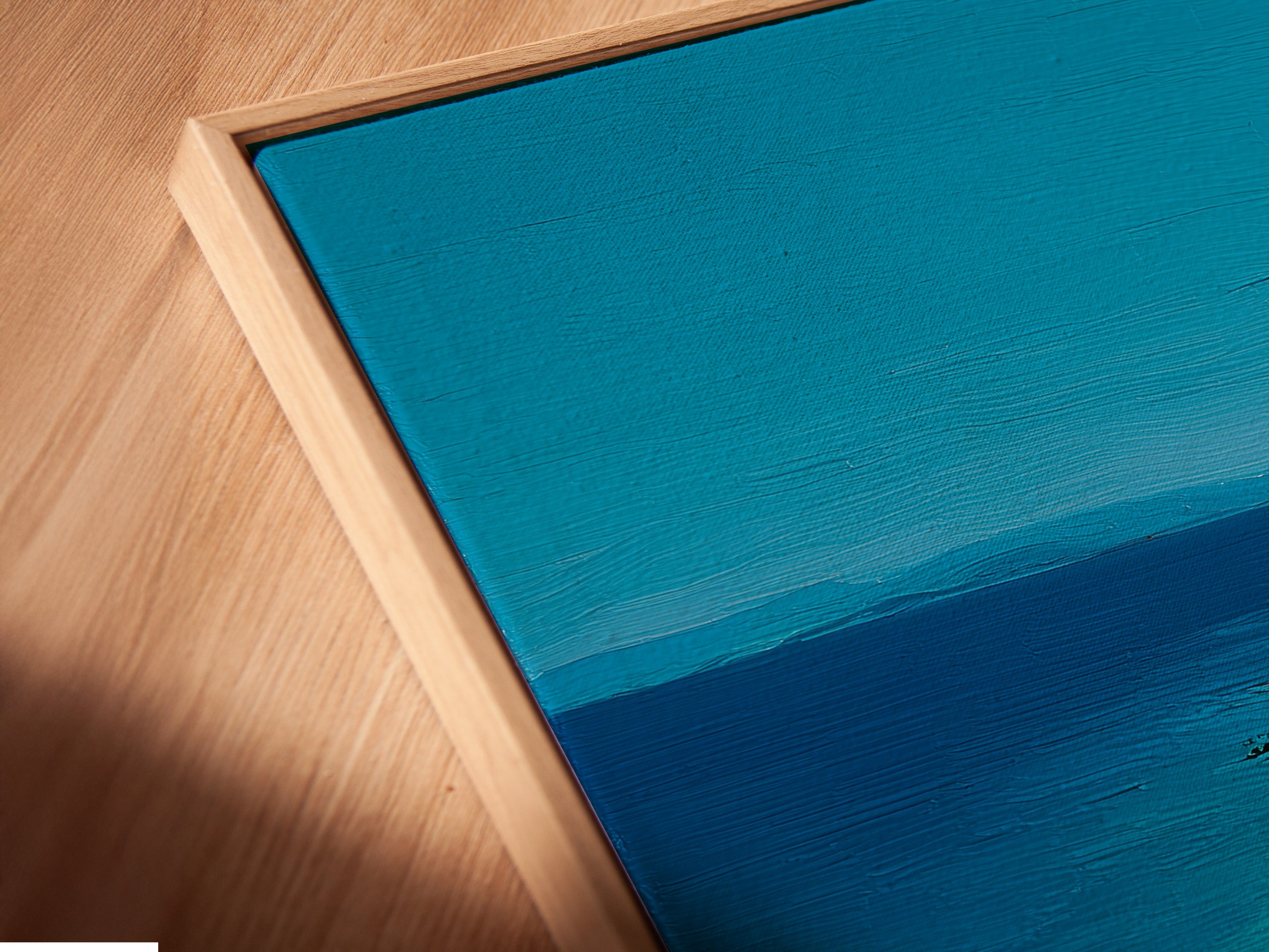 Close-up angled view of a canvas print in a floating frame. A modern framing option that makes the art stand out. The floating frame adds depth and dimension. Perfect for showcasing canvas prints in a unique way. The floating frame is very popular.