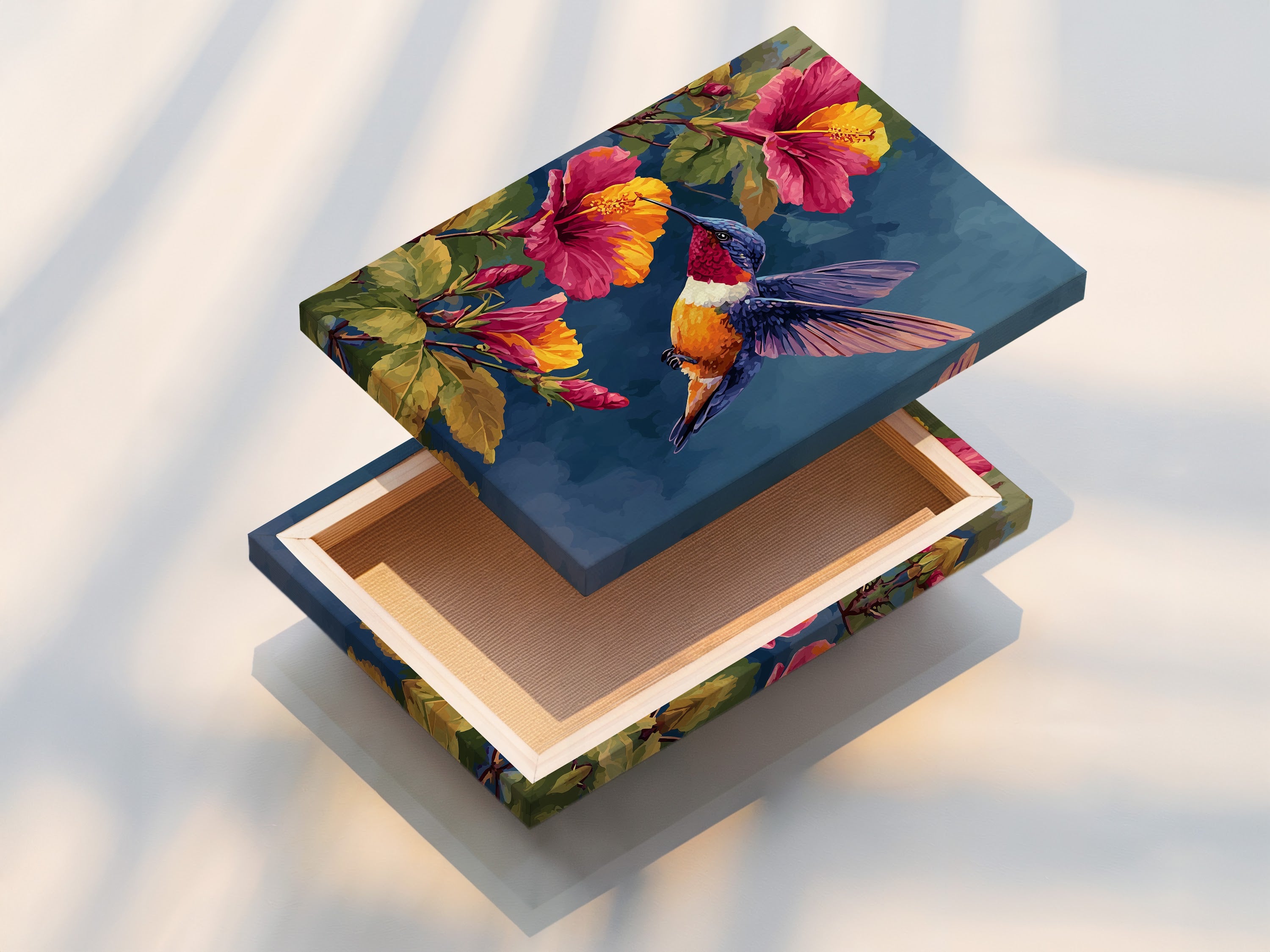 This is a vibrant stretched canvas print. The artwork shows a hummingbird with hibiscus flowers. The canvas provides a gallery-wrapped edge. Ready to hang this artwork adds color to your walls. Discover our canvas print options.