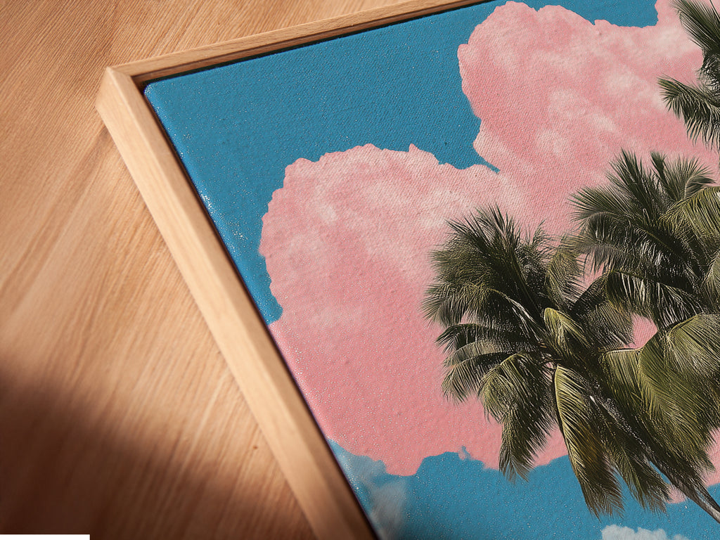 A close up view of our canvas print in a floating frame. The floating frame enhances the artwork. The frame gives it a gallery like appeal. This coastal artwork depicts a tropical island scene. Palm trees and turquoise waters create a serene view.