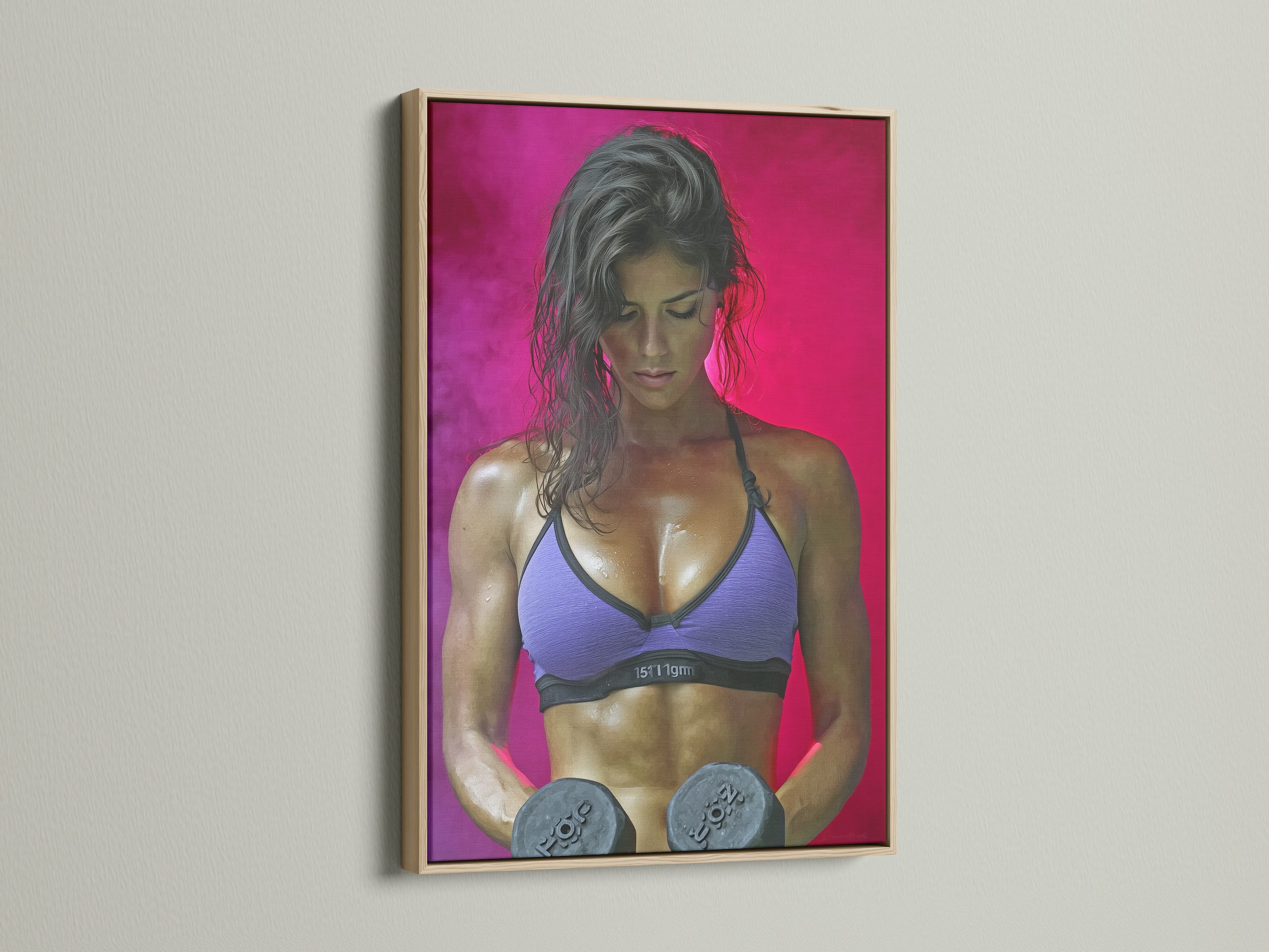 Fitness Woman artwork with an oak frame. The artwork shows a strong woman lifting weights. Ideal for fitness enthusiasts. A great addition to any workout room. Elevate your gym's atmosphere.