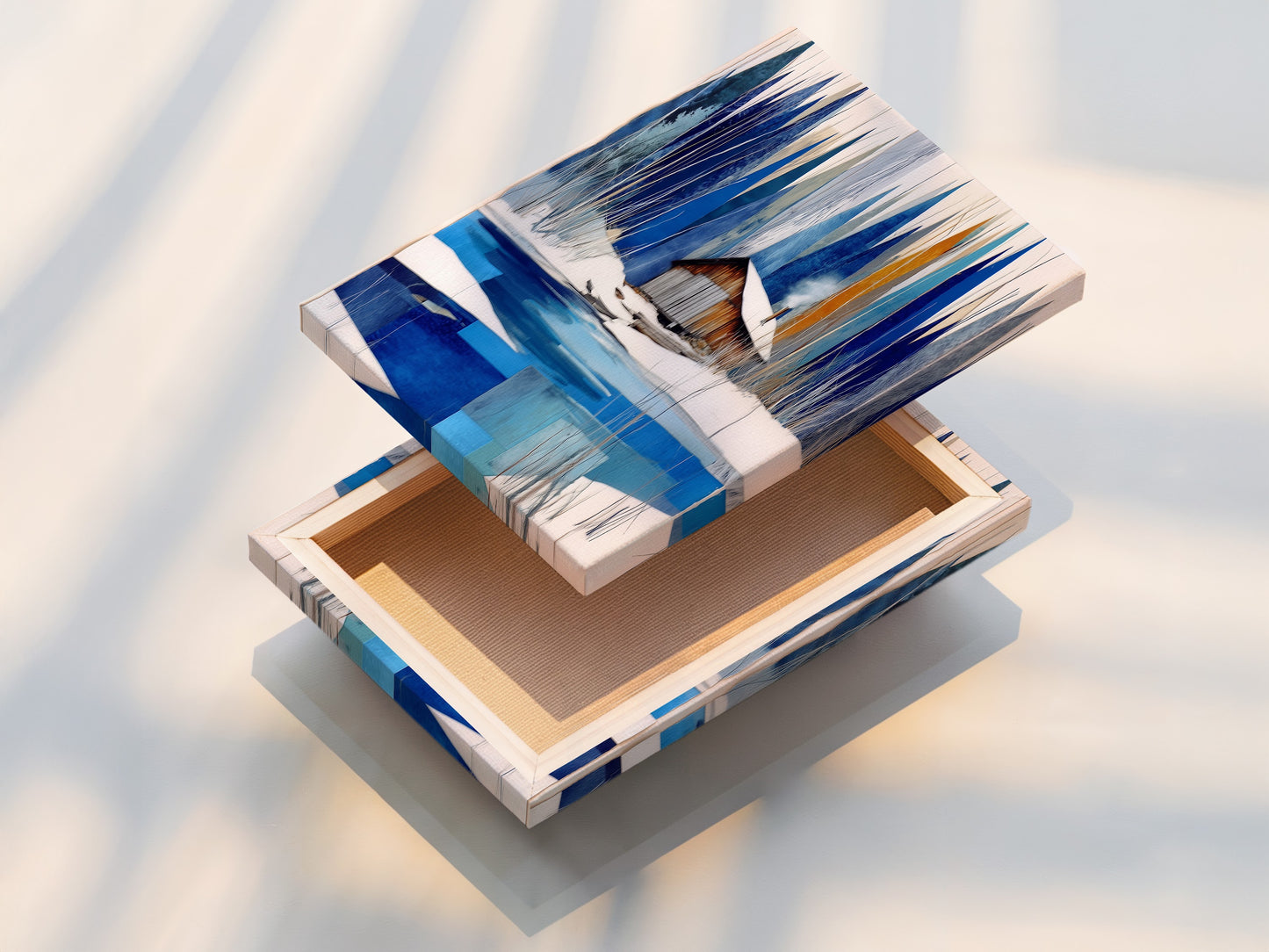 A stretched canvas print displays a captivating winter cabin scene. The artwork features a snowy lake. The blue and white abstract winter art is vividly presented. This modern wall art piece is ready to hang. Ideal for chalet decor and creating a cozy home art atmosphere. Perfect nature print.