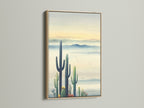 Cactus Wall Art in an Oak Frame. This desert canvas features a serene landscape. The oak frame enhances the Southwestern decor. Ideal for living room wall art or office spaces. It brings nature's beauty indoors.