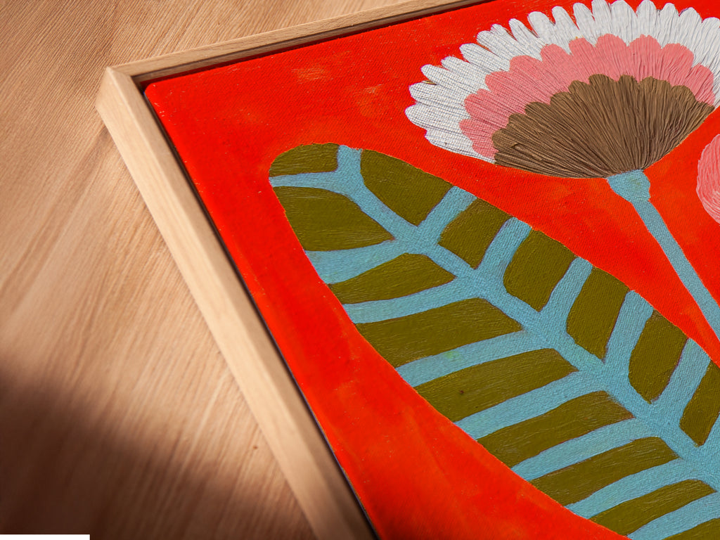 Angled close up of a Coffee Cup Canvas Print in a floating frame. The floral botanical wall art looks modern and sleek. This still life artwork is ready to hang. It enhances cafe wall decor.