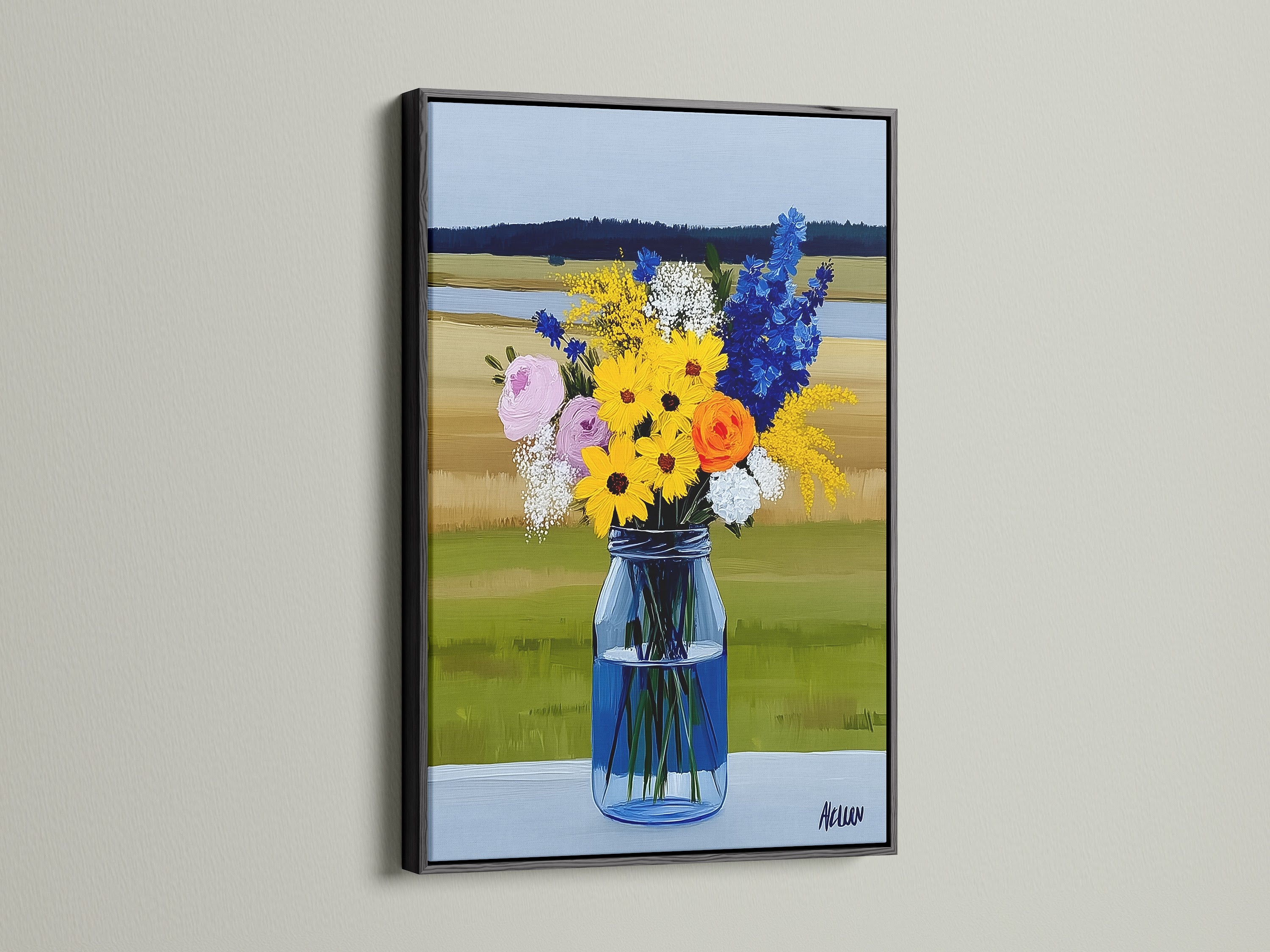 A wildflower bouquet artwork is displayed in a black frame. The art features a still life of flowers in a blue vase. The artwork is a rustic farmhouse style print. It can complement various interior styles.