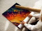 A woman carefully rolling a fine art poster paper. The poster paper is high-quality and smooth. She's preparing the art for framing. Explore our fine art poster paper options. Each print is handled with care. It's ready to add to your space.