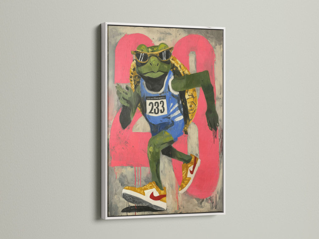 A cool animal art print featuring a frog runner is displayed in a white frame. This artwork brings urban street art vibes. It is perfect for teen room decor. It is also great for fitness motivation. This pop art print adds a unique touch to any wall. The primary color is green with pink accents.