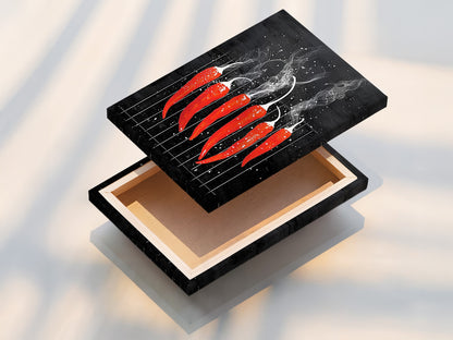 A stretched canvas print featuring red hot chili peppers. The artwork is ready to hang. The stretched canvas offers a clean modern look. It is perfect for restaurant decor or modern kitchen art. It is a spicy addition to any space.