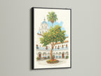 Spanish Courtyard artwork displayed in a black frame. The artwork features a white building with a blue dome and an orange tree. Black frame adds a touch of sophistication. Enhance your study room decor with this vintage travel inspired artwork.