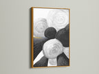 A stunning piece of geometric abstract art with black and white circles. The artwork is highlighted by a gold frame. It adds a touch of luxury to the minimalist art. Perfect for creating a focal point in any modern room. This will elevate your decor.