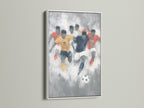 Soccer watercolor wall art presented in a white frame. The artwork showcases an abstract representation of a soccer game. The white frame enhances the sports art print. This is perfect for adding a touch of athletic style to any room. A great gift for a soccer fan.