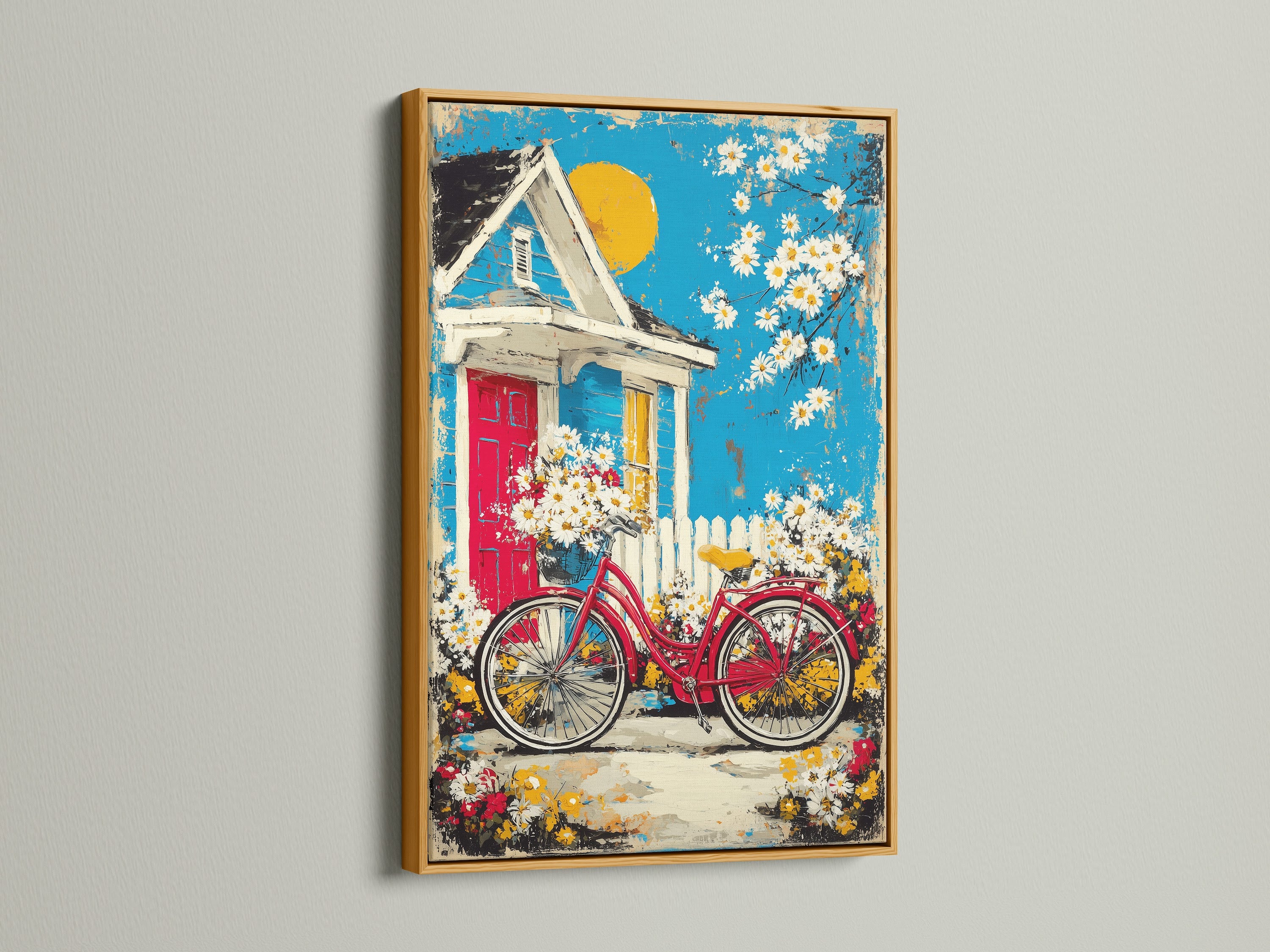 The Cottage Garden artwork is displayed in a gold frame. The frame adds a touch of elegance to the rustic scene. The artwork features a vintage red bicycle adorned with flowers. This is perfect bicycle artwork for a cozy atmosphere.