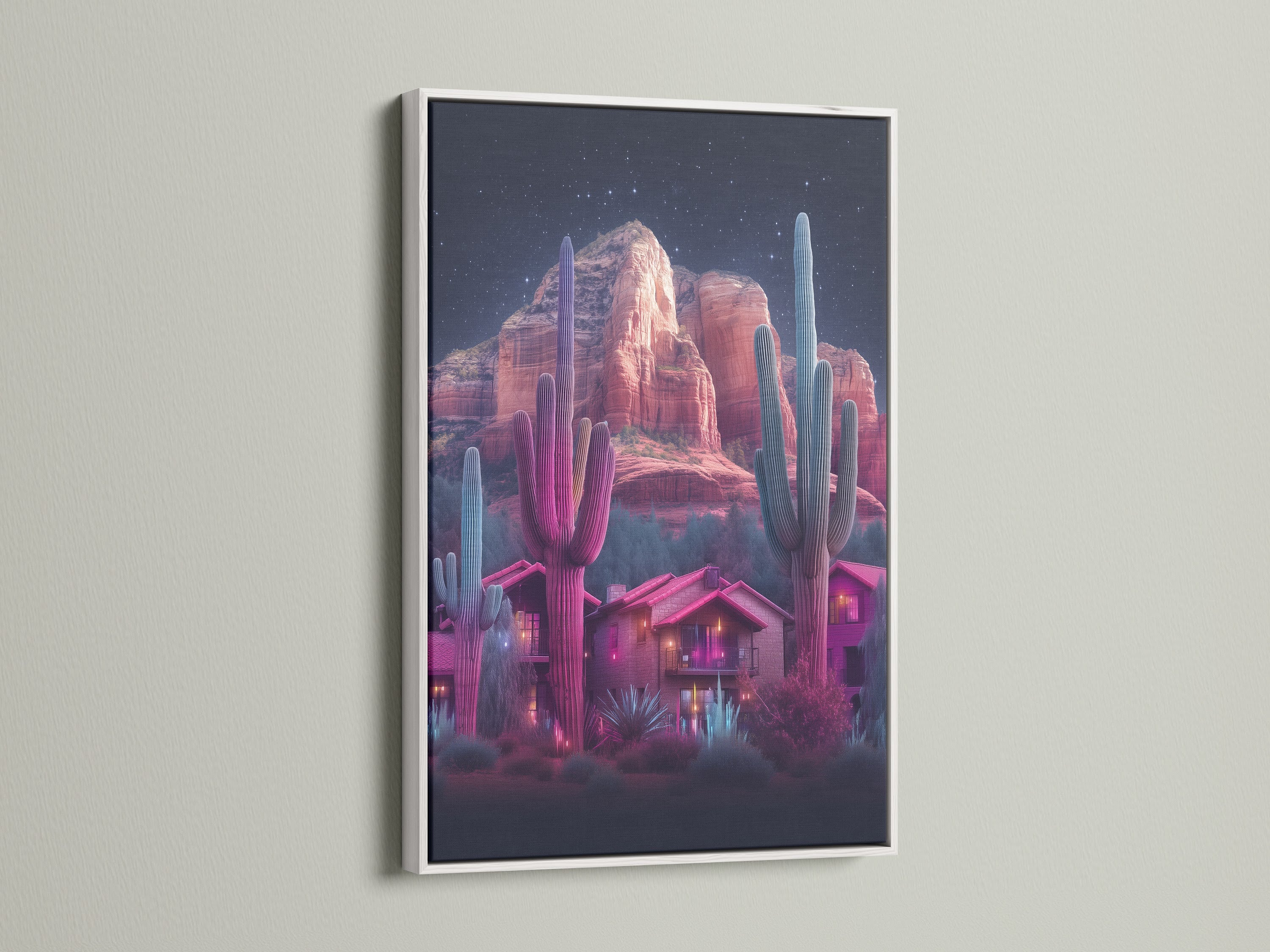 Neon cactus artwork featuring a desert landscape inside a white frame. The artwork showcases a southwestern scene with vibrant pink and teal hues. A great addition to any room. It will elevate your home wall decor with this succulent art.