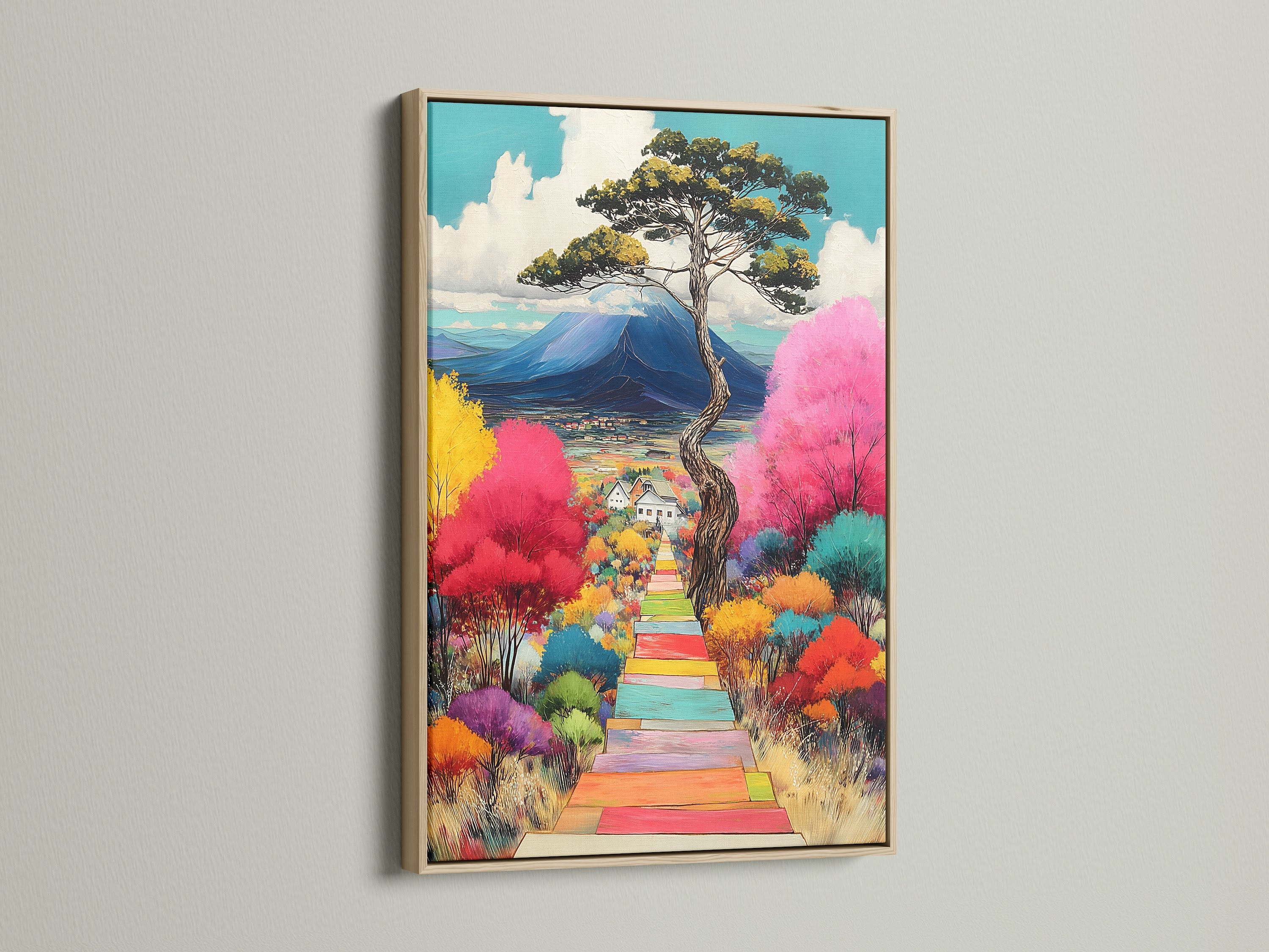 A vibrant landscape artwork graces a wall. The art is framed in a light oak. The colorful trees and mountain view create a whimsical nature print. Ideal home wall decor for modern interiors.