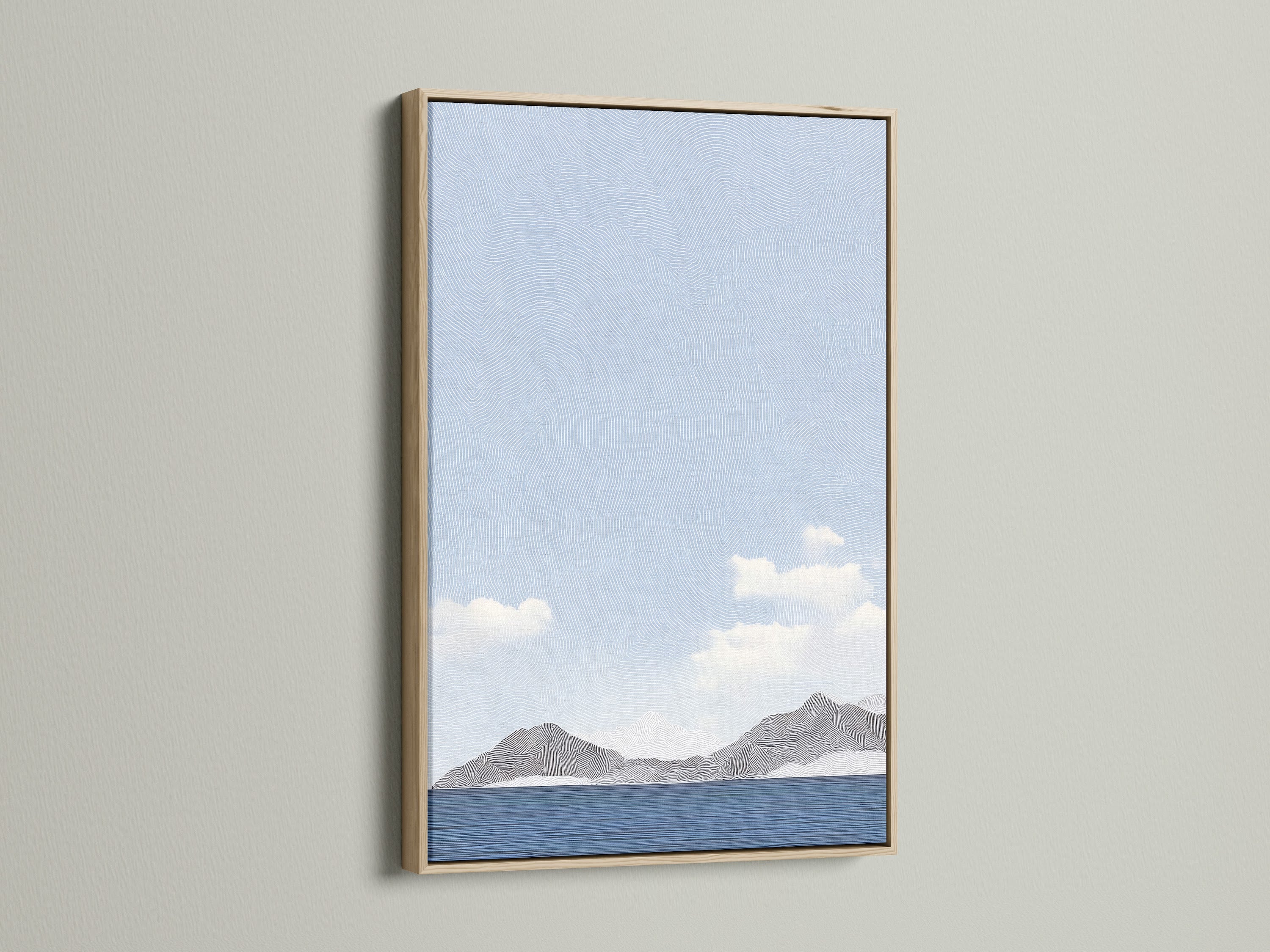 A serene art piece hangs in an oak frame. The artwork displays a landscape of mountains meeting the sea. The oak frame enhances the room's decor. This piece brings nature indoors with its calming scene.