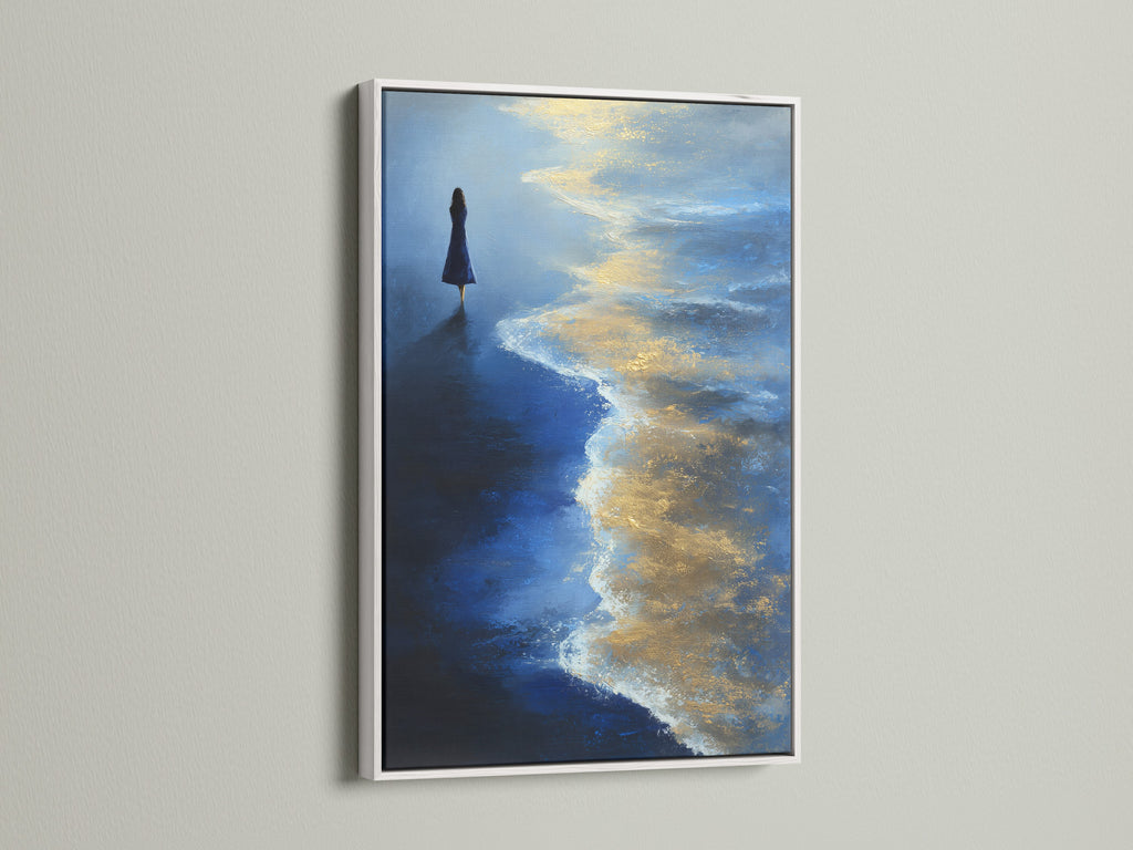 Ocean Solitude artwork with a white frame. The fine art print captures the essence of coastal living. The blue and gold colors evoke a sense of peace. Ideal for bedroom wall decor or living room wall art.