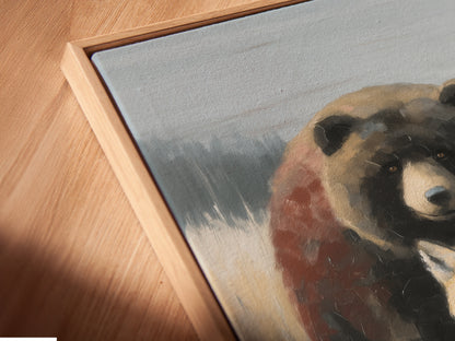 A close-up of a Wildlife Trio canvas print in a floating frame. The artwork features a bear fox and wolf. Neutral tones create a rustic feel. This animal-themed wall art is perfect for cabin decor. A unique addition to any space.