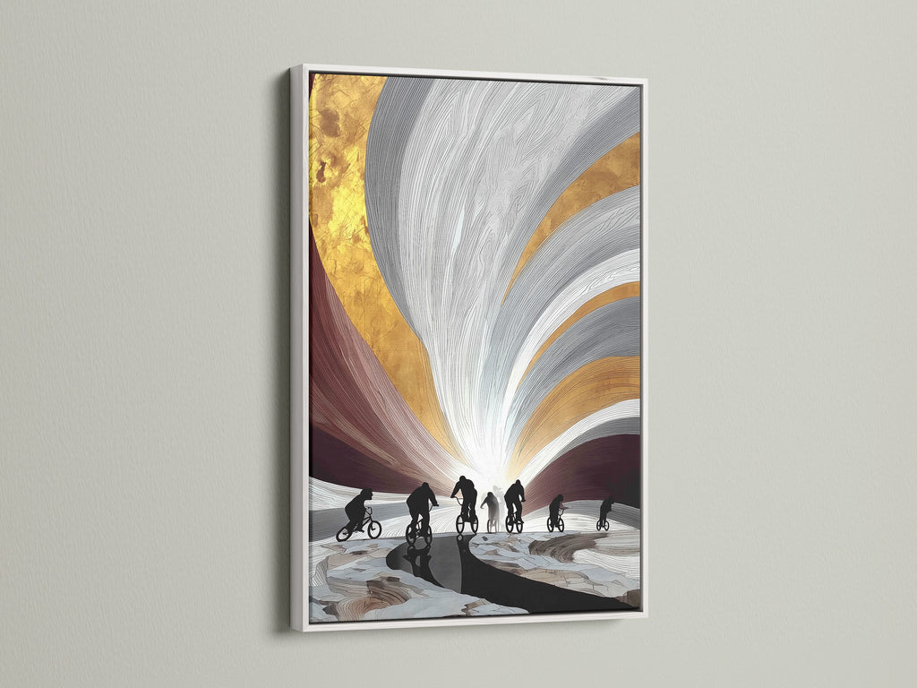 See cyclist artwork with a white frame. This piece features cyclists in silhouette with gold and gray accents. The white frame offers a clean modern look. A great addition to any contemporary art collection.