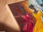 A close-up angled view of the Dancing Figures canvas print. The artwork is beautifully presented in a floating frame. This expressive art style adds depth and dimension to your wall decor. It is perfect for modern spaces.