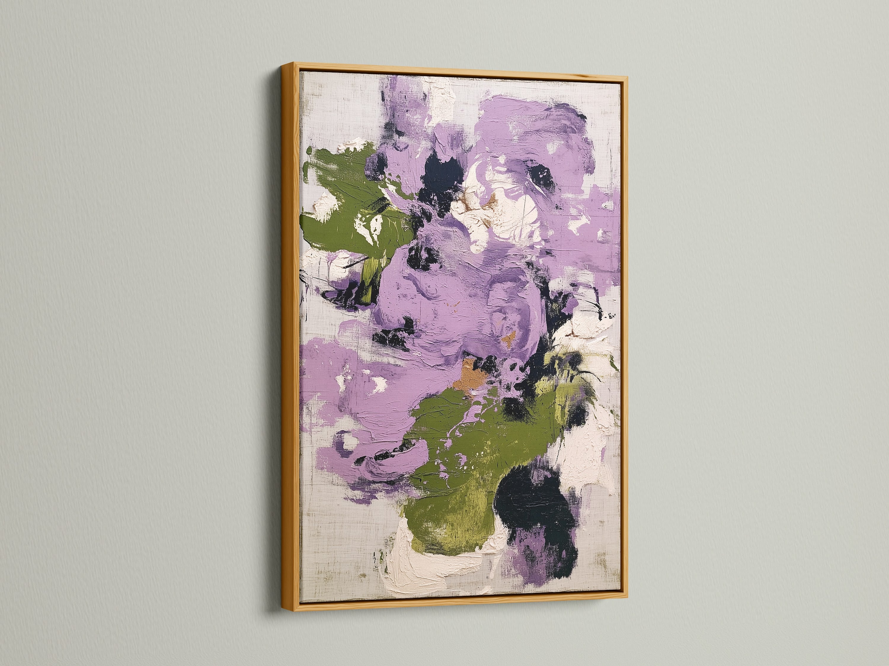 Abstract floral artwork featuring purple and green colors in a gold frame. This contemporary art piece brings a touch of luxury and elegance to any room. The botanical print is ideal for enhancing bedroom wall decor with its shimmering gold accents.