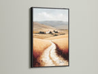 Tuscan Landscape artwork with a black frame. This Italy art print adds a touch of elegance to any space. The farmhouse decor enhances the neutral tone art. Italian scenery captures the beauty of a wheat field. Bring rustic wall art to your living room with this stunning piece.