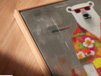 A close-up angled view reveals a canvas print in a floating frame. The artwork showcases a cool polar bear in a tropical shirt. This quirky animal art is perfect for adding a unique touch to your home decor. The art is vibrant and fun.