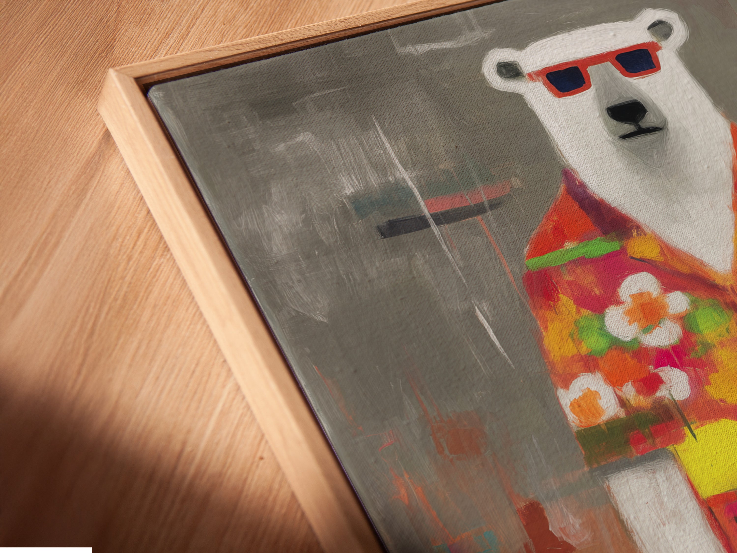 A close-up angled view reveals a canvas print in a floating frame. The artwork showcases a cool polar bear in a tropical shirt. This quirky animal art is perfect for adding a unique touch to your home decor. The art is vibrant and fun.