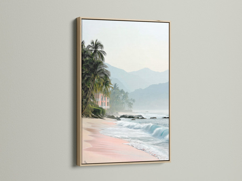 This is a stunning tropical beach canvas print. It is framed in oak. The artwork brings coastal scenery to life. Pink sand and ocean views create a relaxing vacation home decor.