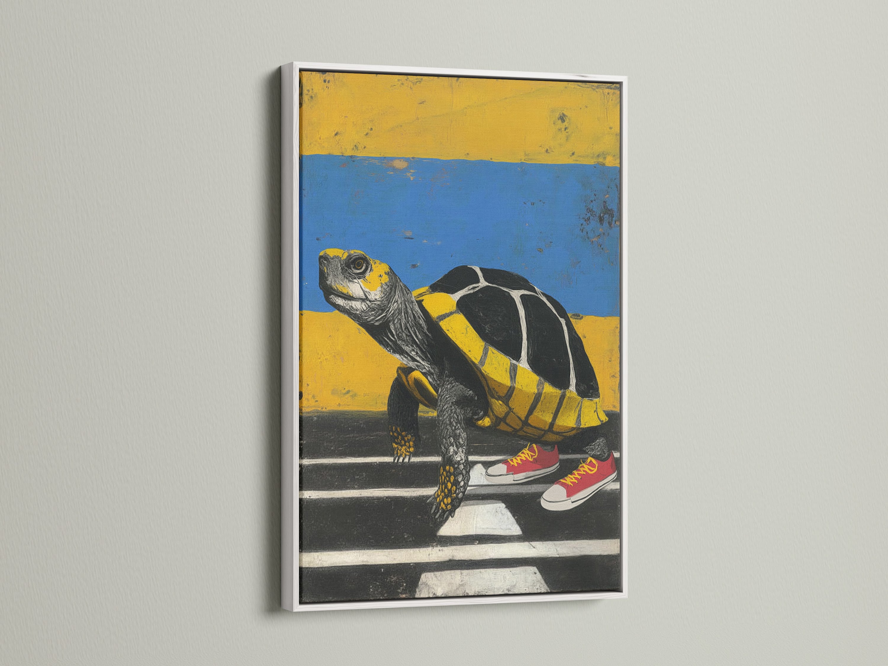 A white frame enhances this turtle art print. The quirky wall decor features a turtle wearing sneakers. It's a modern art piece perfect for adding color to any room. This whimsical print is ideal for a study room or office. The artwork includes yellow and blue hues.