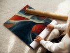 A woman is carefully rolling a fine art poster paper. The poster paper is of high quality ensuring vibrant colors and sharp details. The process highlights the care taken in preparing art prints. Perfect for art enthusiasts.