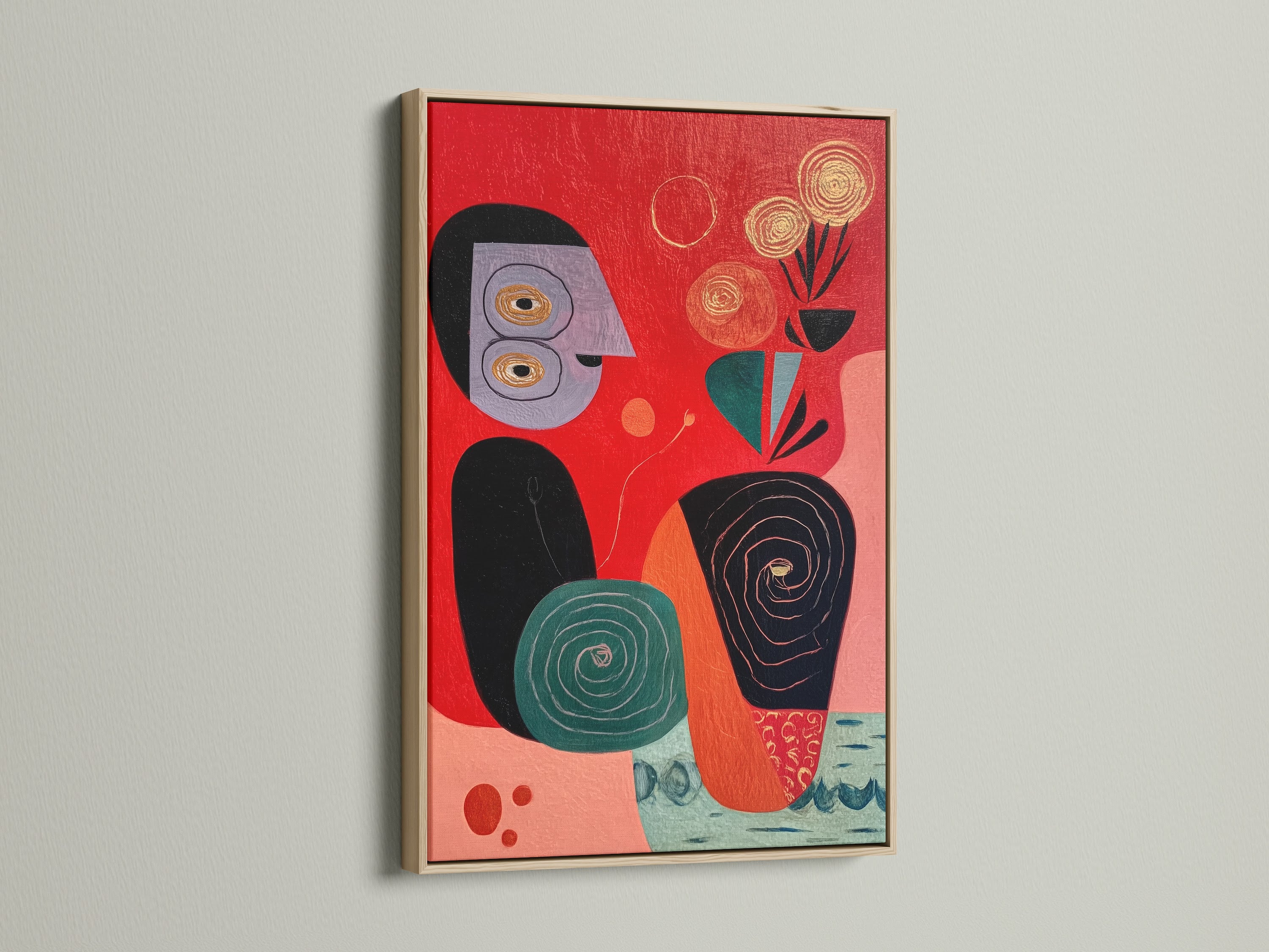 A vibrant piece of abstract folk art is displayed in an oak frame. The red artwork features teal and black shapes. This mid-century modern canvas print will enhance any living space. Discover our unique collection now.