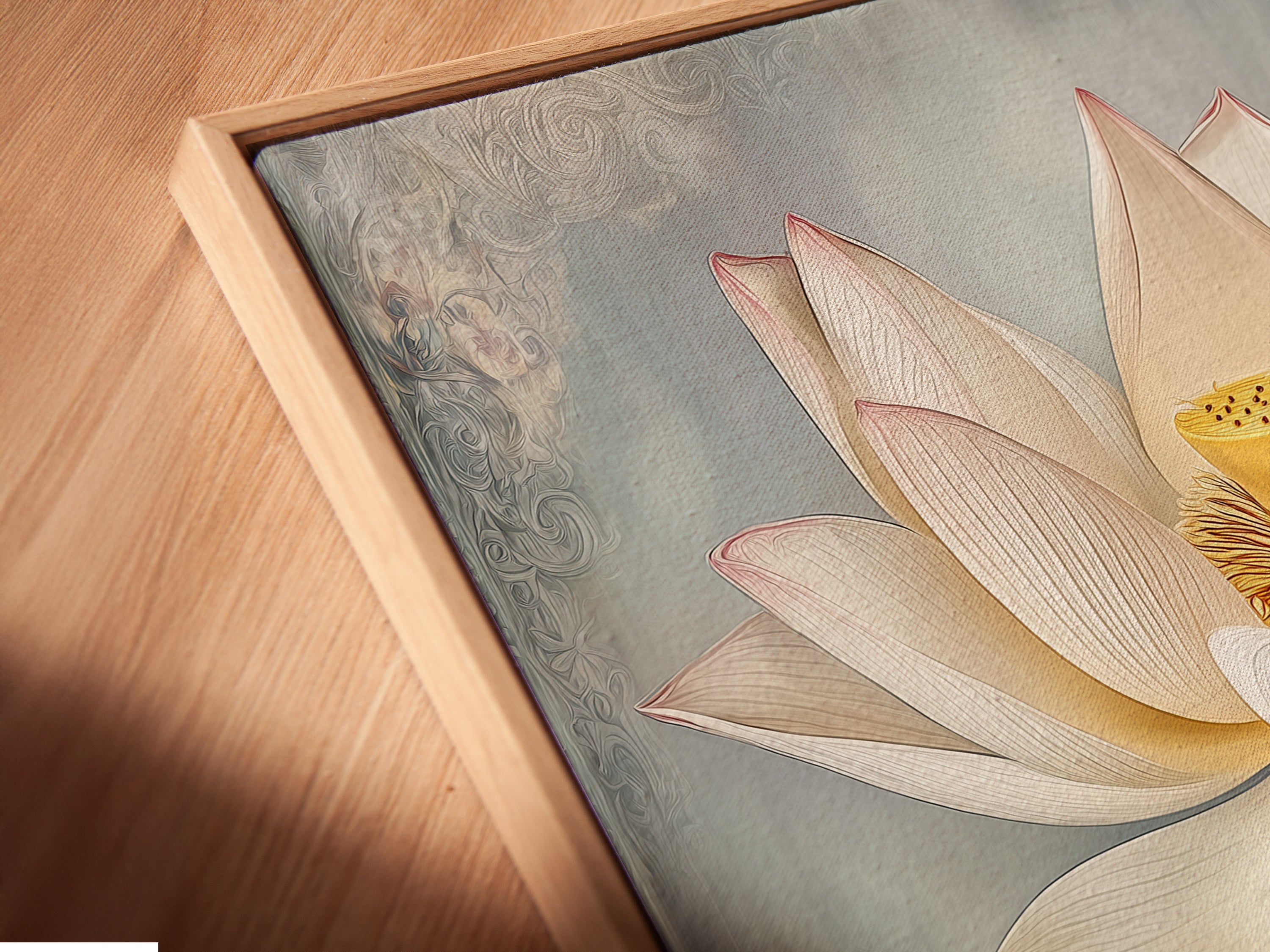 Close up of a canvas print in a floating frame. The Lotus Flower artwork adds modern elegance. This botanical wall art is perfect for a bedroom spa or living room. Bring calming zen to your home.