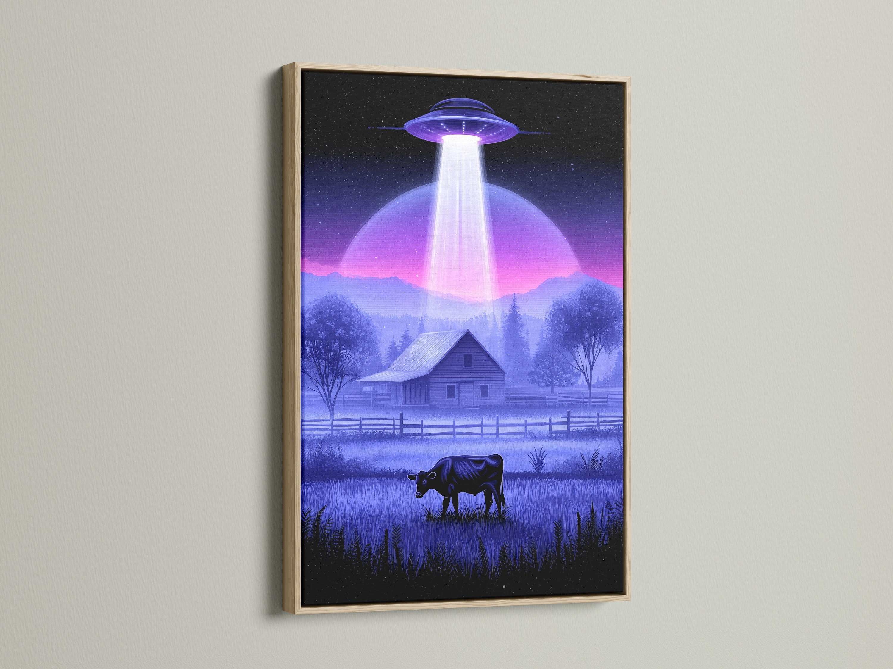 This is UFO Abduction artwork in an oak frame. The alien canvas art enhances the sci-fi landscape. It adds a touch of the unexpected to your decor. The cow art print is perfect for a unique farmhouse style. Great for living rooms or offices.