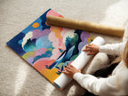 A woman is carefully rolling a fine art poster paper. The paper is of high quality ready for printing. She is working with care to avoid any creases. Fine art posters are a great way to enjoy art.