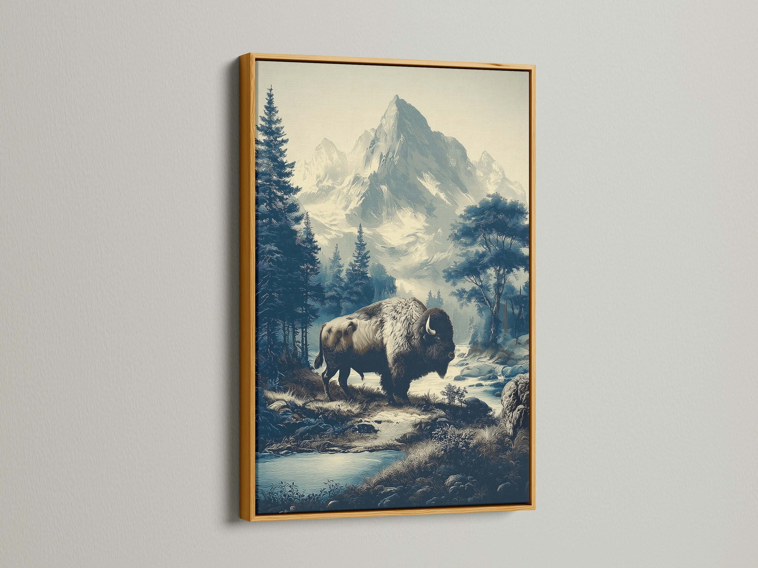 Buffalo Mountain Art with gold frame. The wilderness art is a vintage nature print. It is perfect for rustic cabin decor. The gold frame enhances the mountain landscape. This bison canvas art is a great addition to your home. This artwork adds a touch of elegance