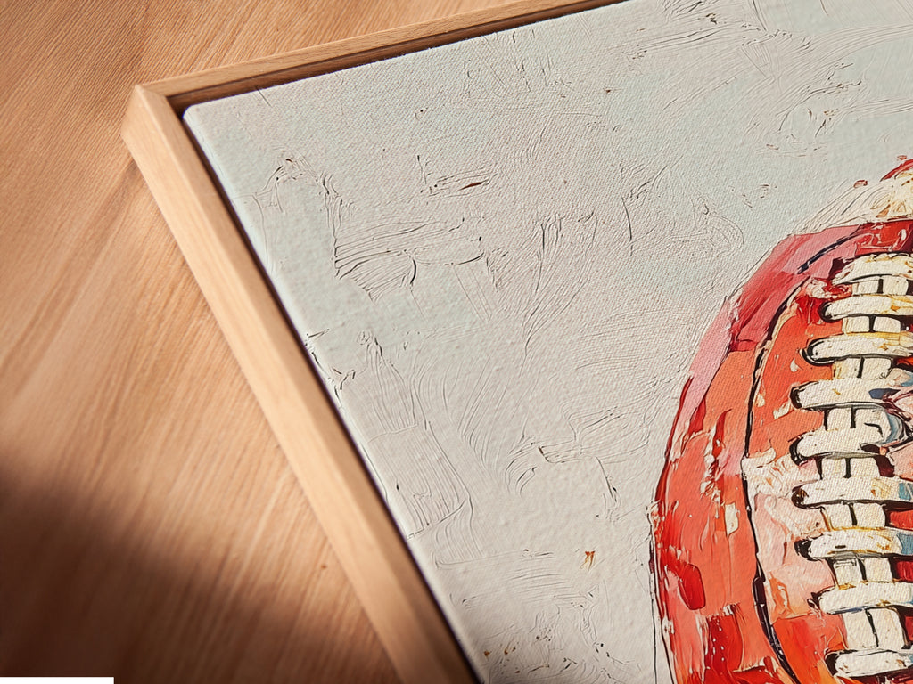 Get a close-up view of this canvas print. This angled shot reveals the intricate details of the painted style football. The artwork is set in a floating frame. This sports canvas is perfect for adding a unique touch to your space. Ideal for a man cave or game room.