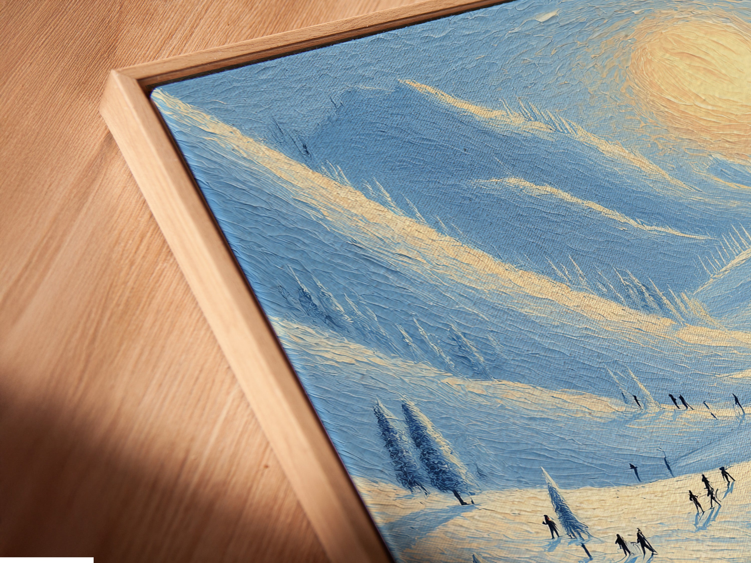 A close-up angled view reveals a canvas print in a floating frame. The winter landscape art features a snowy mountain lake. This is perfect for living room wall art. It is a blend of blue and white.