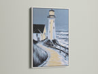 Lighthouse coastal artwork in a white frame. This seascape wall art brightens up your office or home. The white frame enhances the artwork. It is perfect for minimalist and Scandinavian styles. 