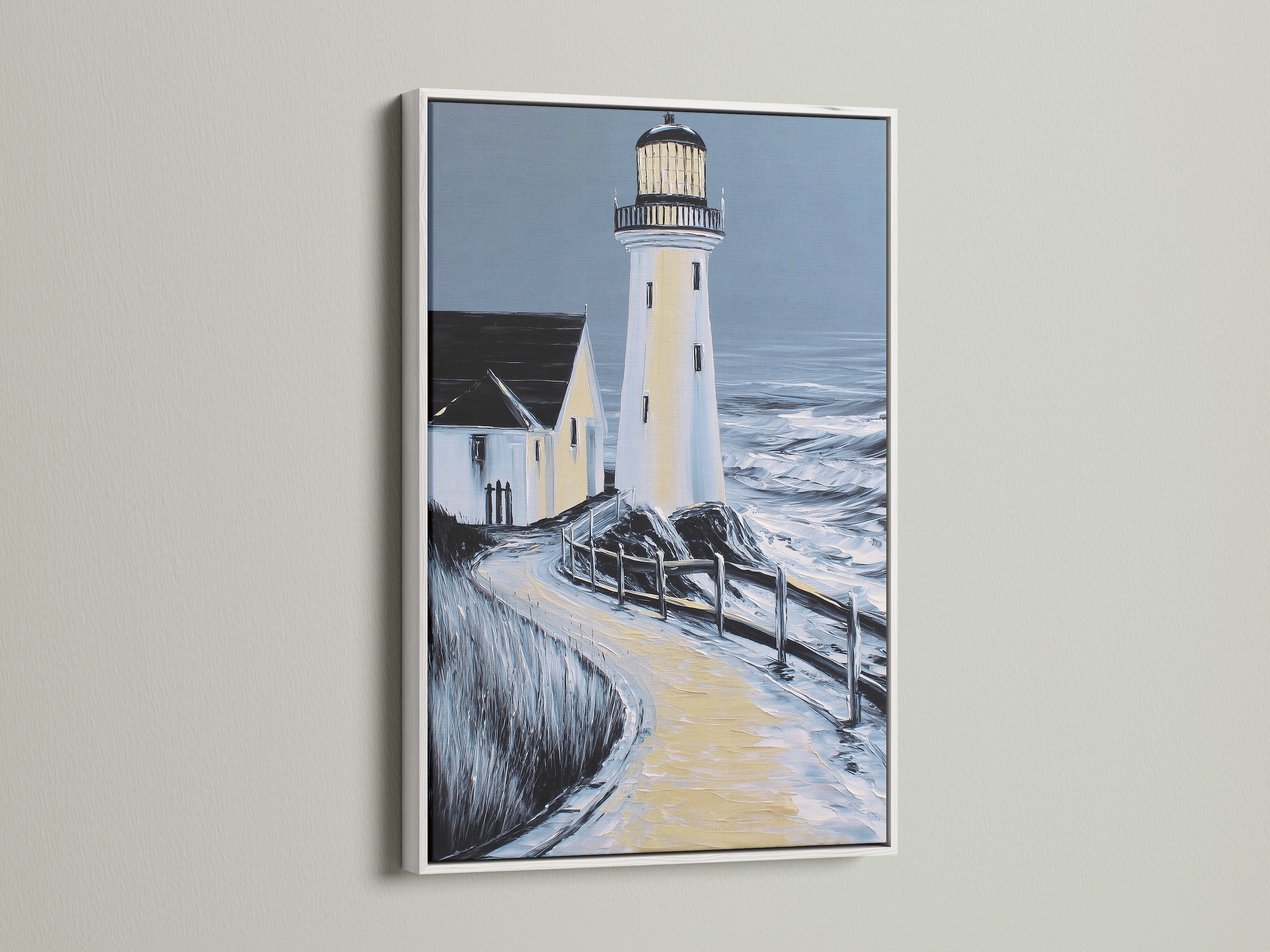 Lighthouse coastal artwork in a white frame. This seascape wall art brightens up your office or home. The white frame enhances the artwork. It is perfect for minimalist and Scandinavian styles. 