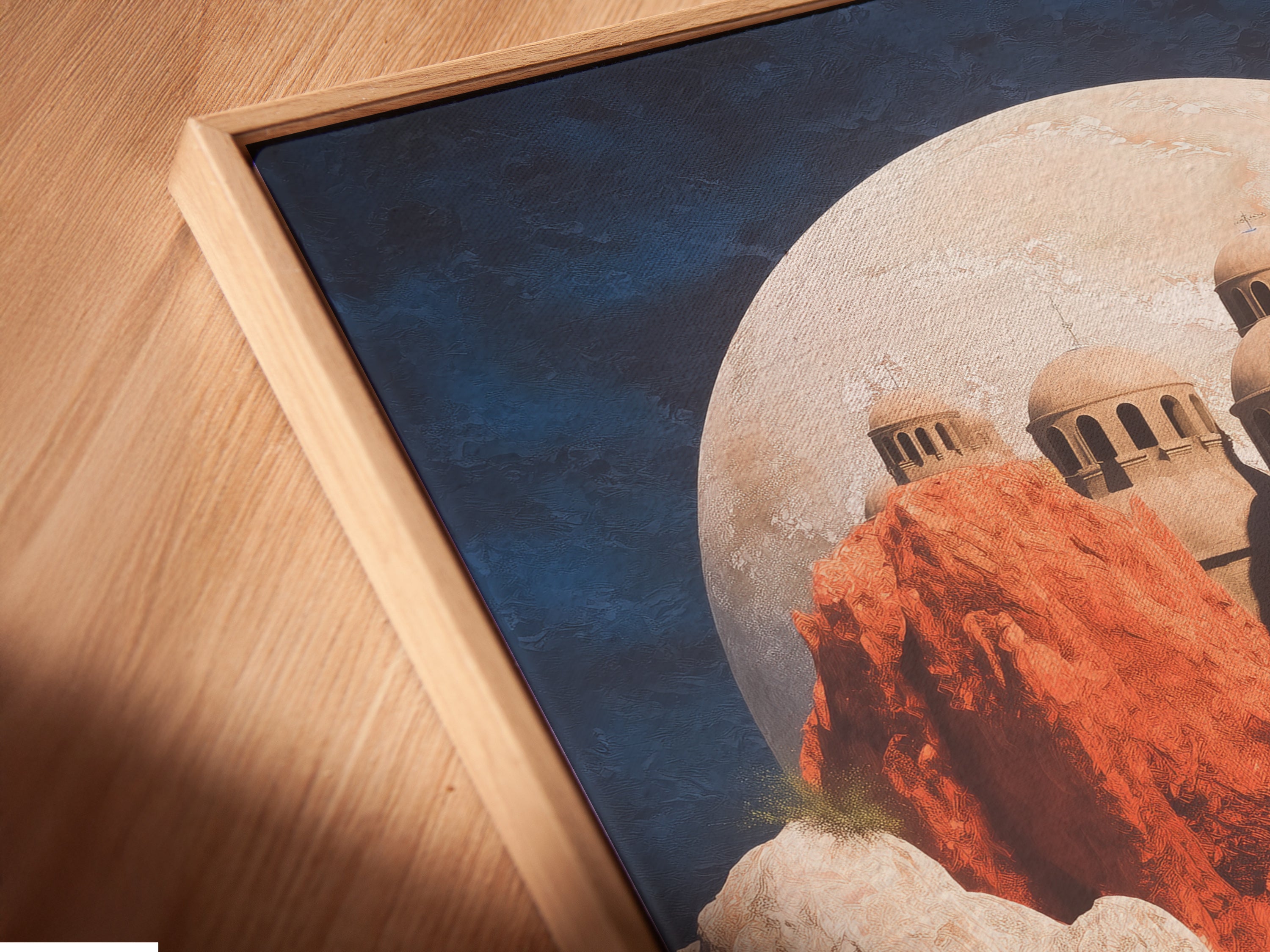 A close up angled view of a canvas print in a floating frame. The fantasy landscape artwork features a dreamy floral field. This unique wall decor enhances any room. It is perfect for homeowners and renters.