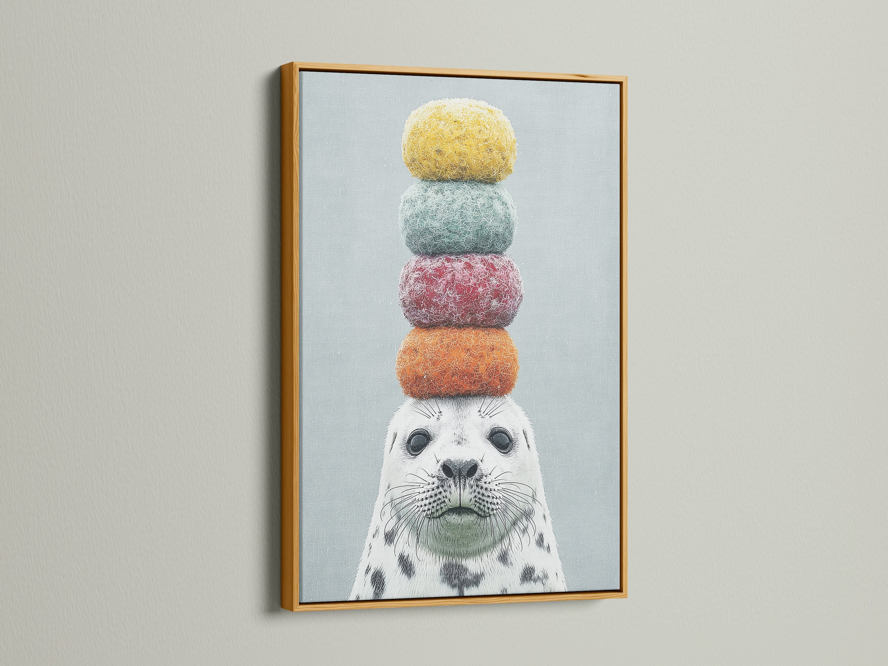 The charming seal artwork with macarons is highlighted by a gold frame. A touch of elegance to this playful animal art. Perfect for adding a whimsical touch to any room. This colorful canvas print is a delightful choice for nursery or kids room decor.