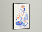 DJ Turntable artwork in a black frame. This music lover wall art adds a touch of retro flair to any room. It is perfect as dorm decor or studio wall art. Ideal for anyone looking to enhance their space with vintage music prints. This artwork is a unique gift for music professionals.
