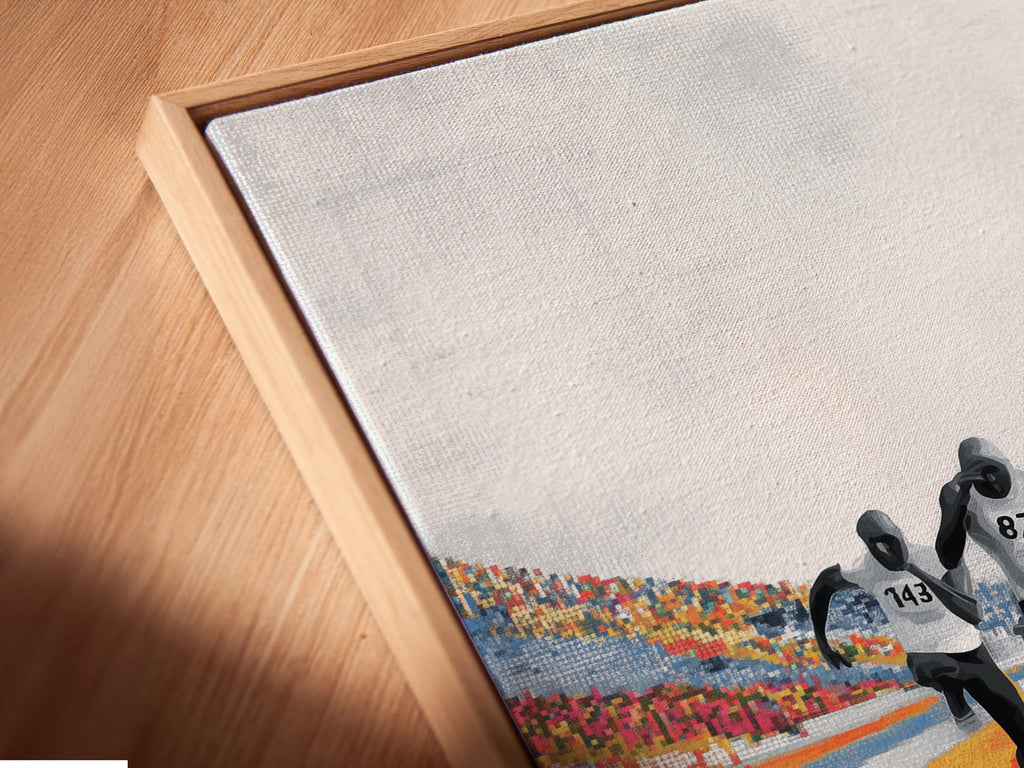 A close up angled view of a canvas print in a floating frame is featured. This showcases the modern contemporary style. The marathon runners artwork is perfect for adding a touch of sports motivation. The blue orange track stadium decor enhances any space.