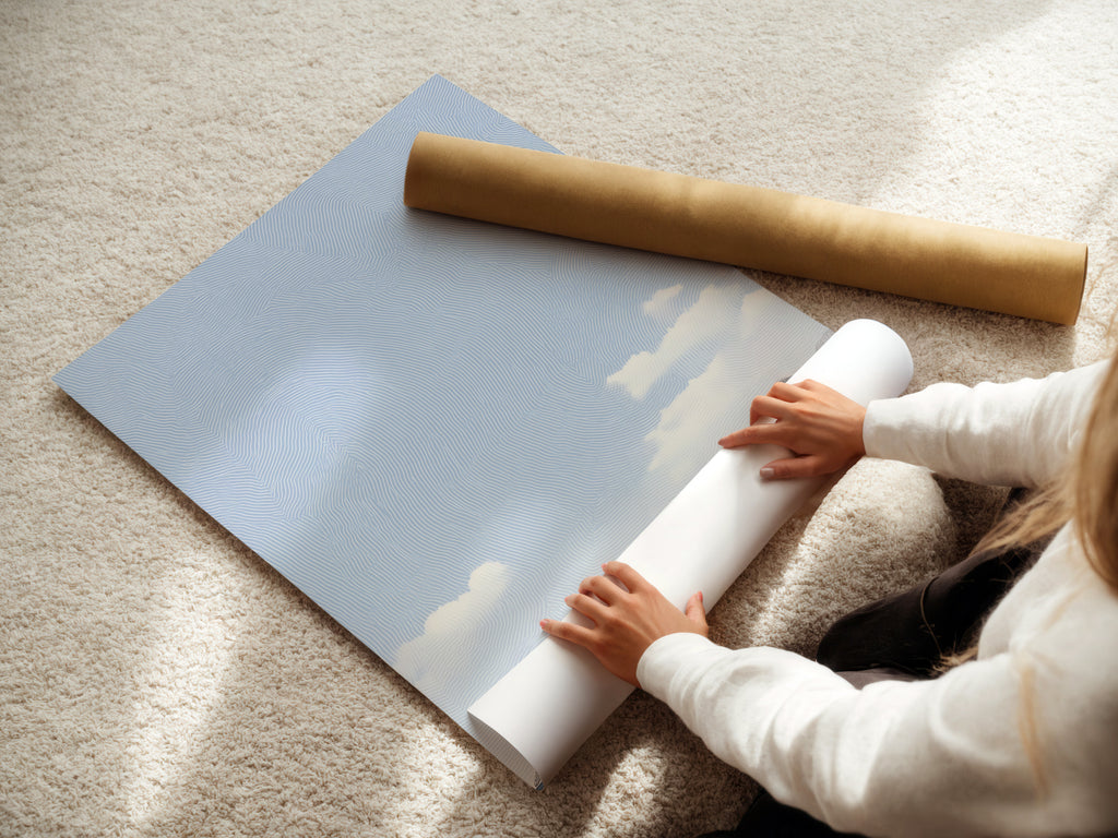 A woman carefully rolls fine art poster paper. The paper is high-quality ensuring lasting beauty. This shows attention to detail and care. High-quality materials preserve artwork. This process ensures safe delivery.