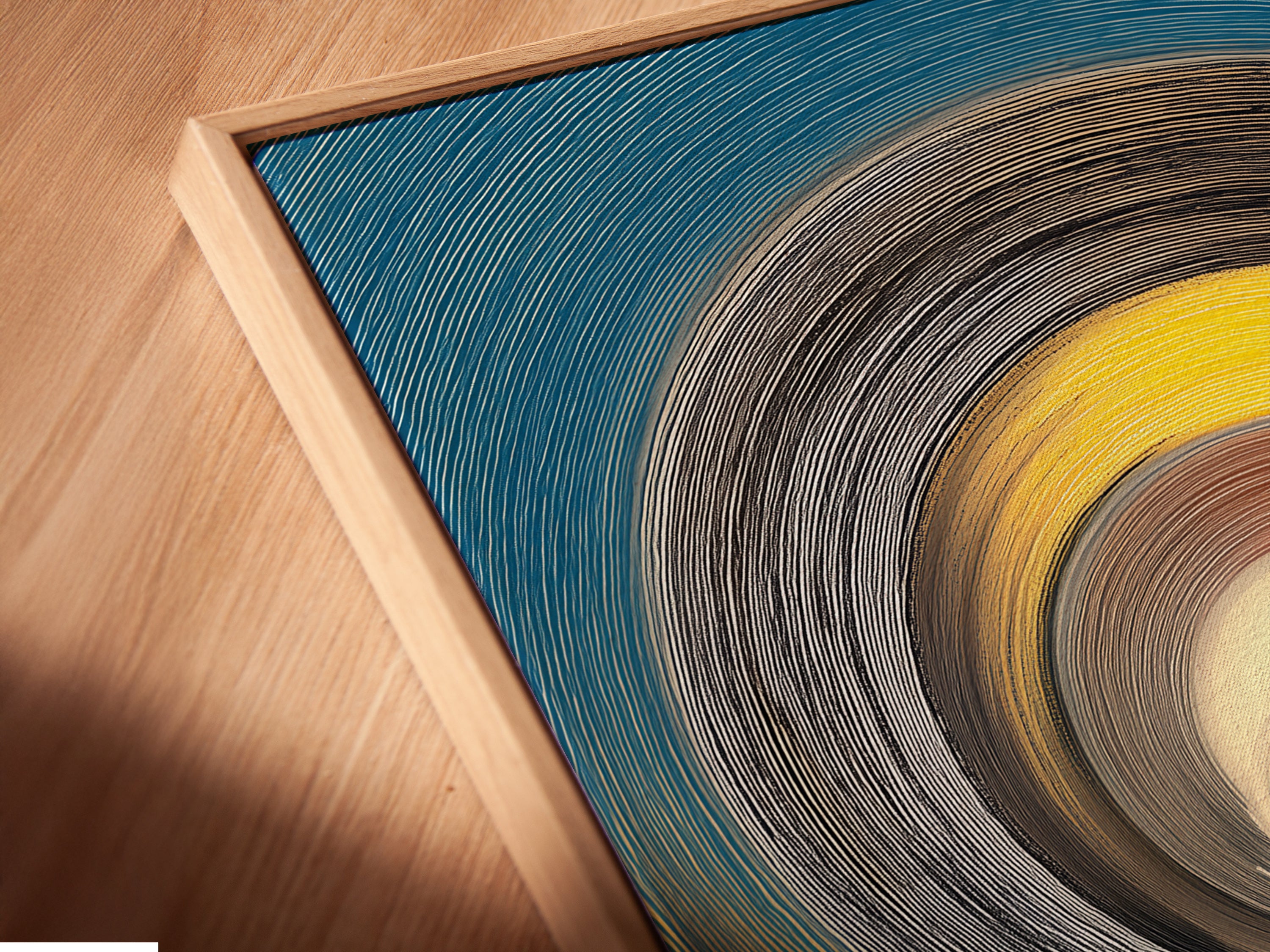 Angled close-up reveals a canvas print in a floating frame. The floating frame creates a unique shadow effect. This offers a gallery-style presentation. Perfect for contemporary artwork. Experience the unique depth of floating frames. Elevate your living room artwork.