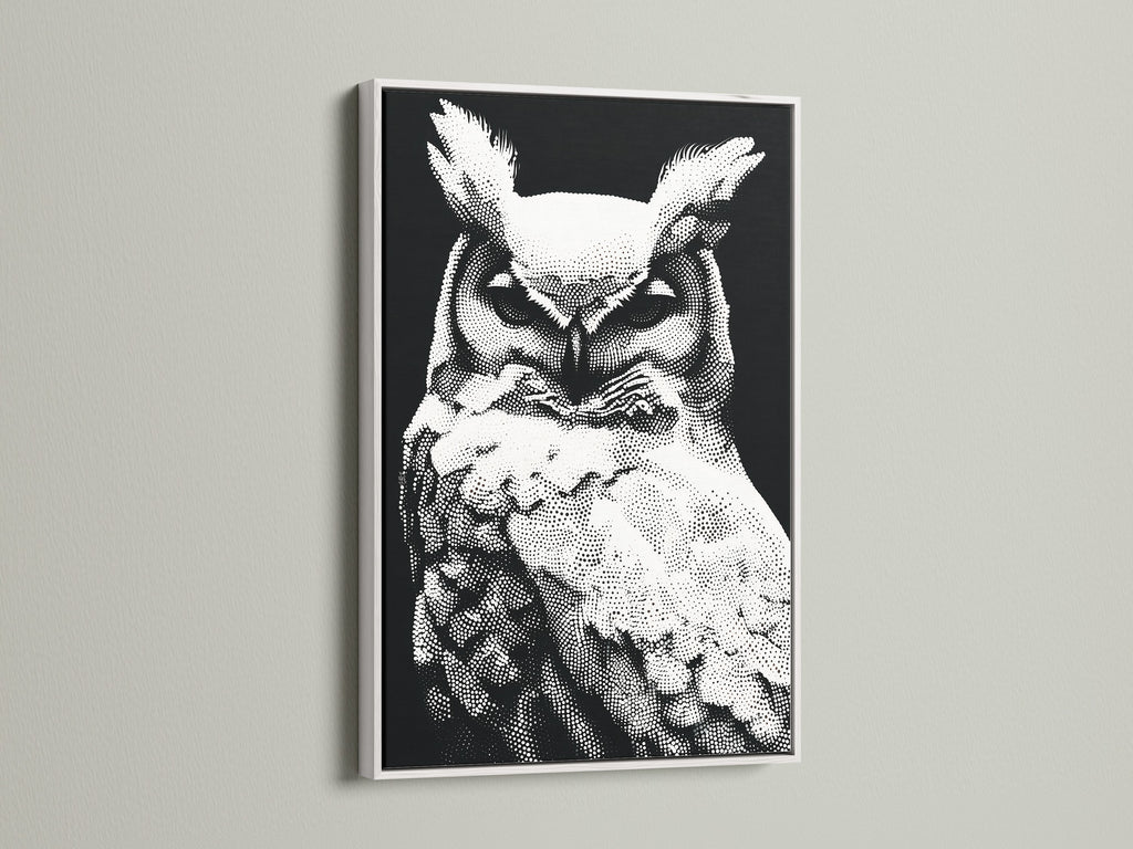 An elegant white frame surrounds this owl artwork. The black and white wildlife print complements the frame. The modern dotted bird canvas is a great addition to any space. Ideal for minimalist animal art decor. Perfect for creating a serene study room environment.