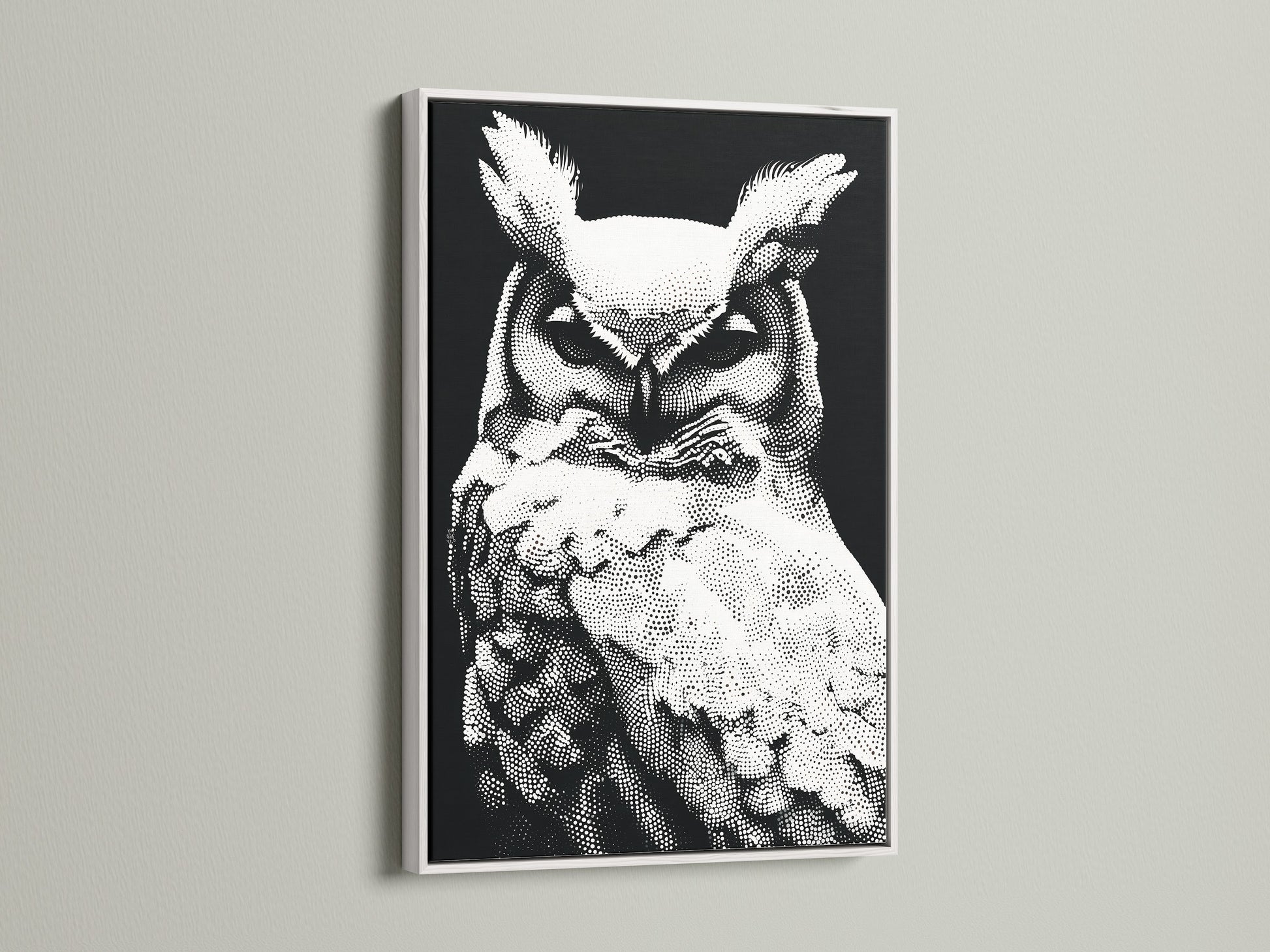 An elegant white frame surrounds this owl artwork. The black and white wildlife print complements the frame. The modern dotted bird canvas is a great addition to any space. Ideal for minimalist animal art decor. Perfect for creating a serene study room environment.