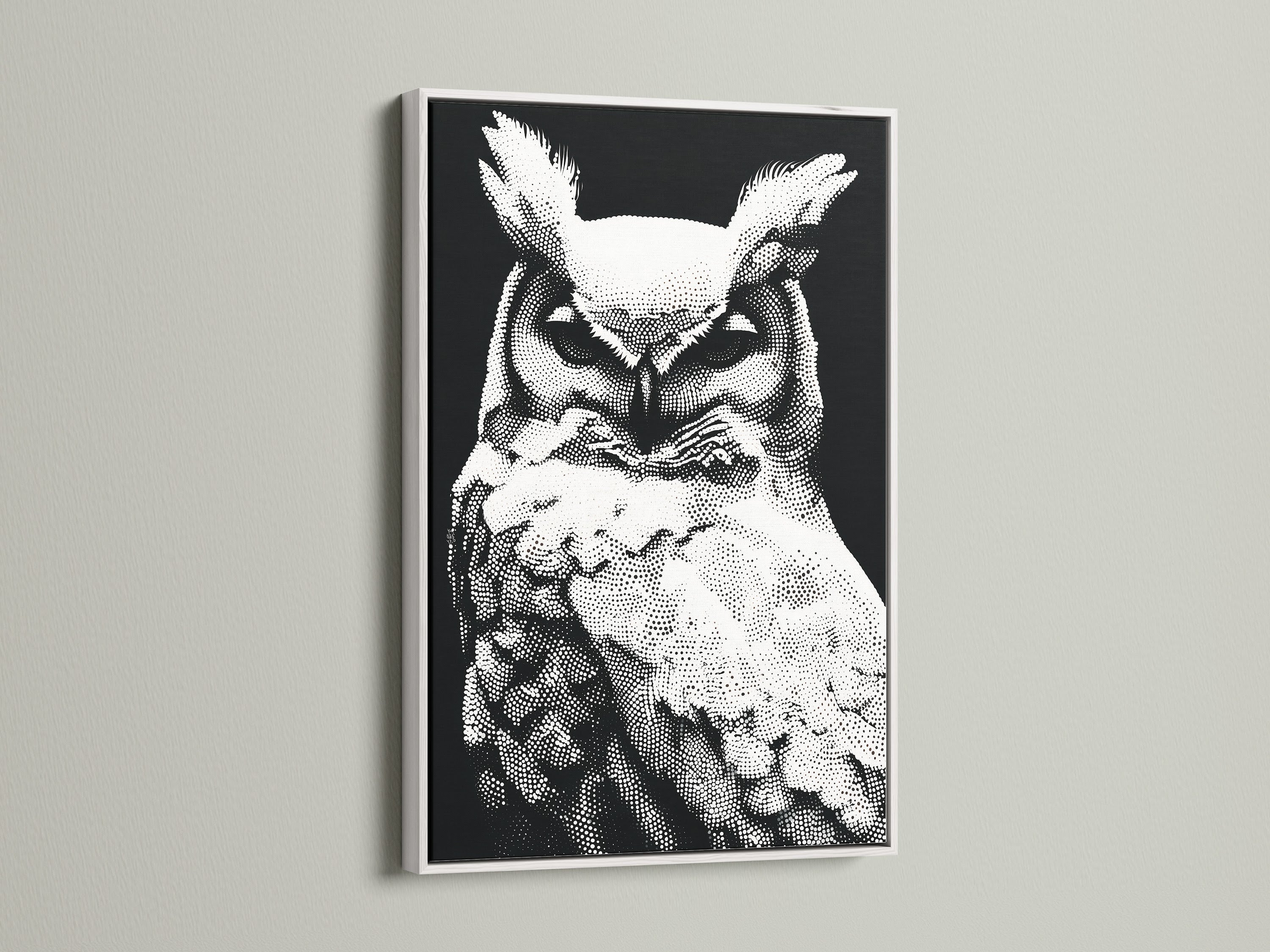 An elegant white frame surrounds this owl artwork. The black and white wildlife print complements the frame. The modern dotted bird canvas is a great addition to any space. Ideal for minimalist animal art decor. Perfect for creating a serene study room environment.