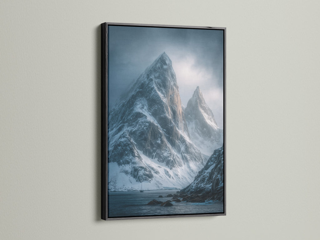 A sleek black frame is displayed. It provides a classic contrast to a Snowy Mountain Peaks Canvas Print. This frame suits contemporary artwork. Perfect for office wall art and winter landscapes in beige and grey.